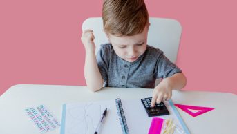 Boy using a calculator