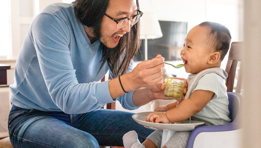 Infant eating its food.