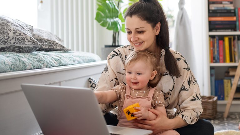 Mother and child interacting with a laptop
