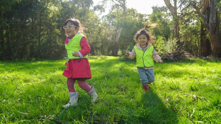 Kids running around on the grass